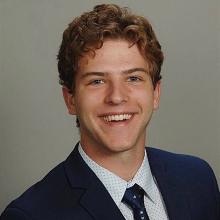 Kevin Krill smiling in a blue blazer